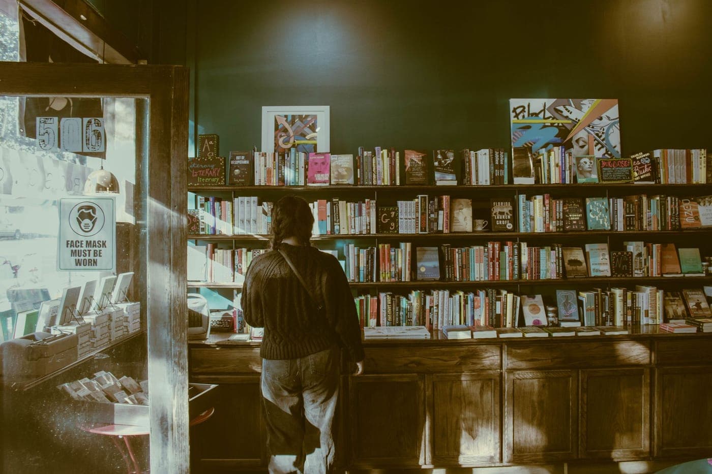 Shelves of fantasy paperbacks in a bookshop