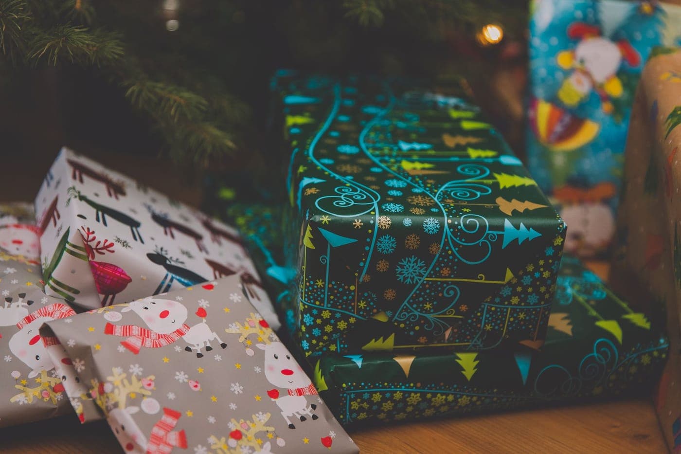 Wrapped presents under a Christmas tree