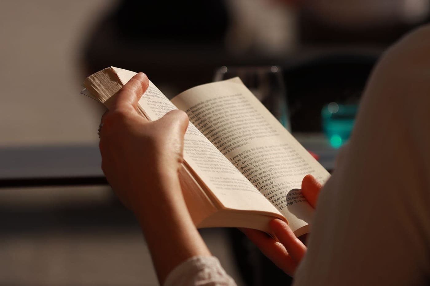 Hands holding an open book
