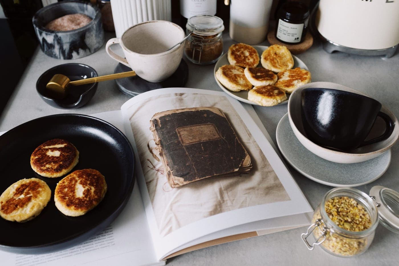 A book open on a kitchen table