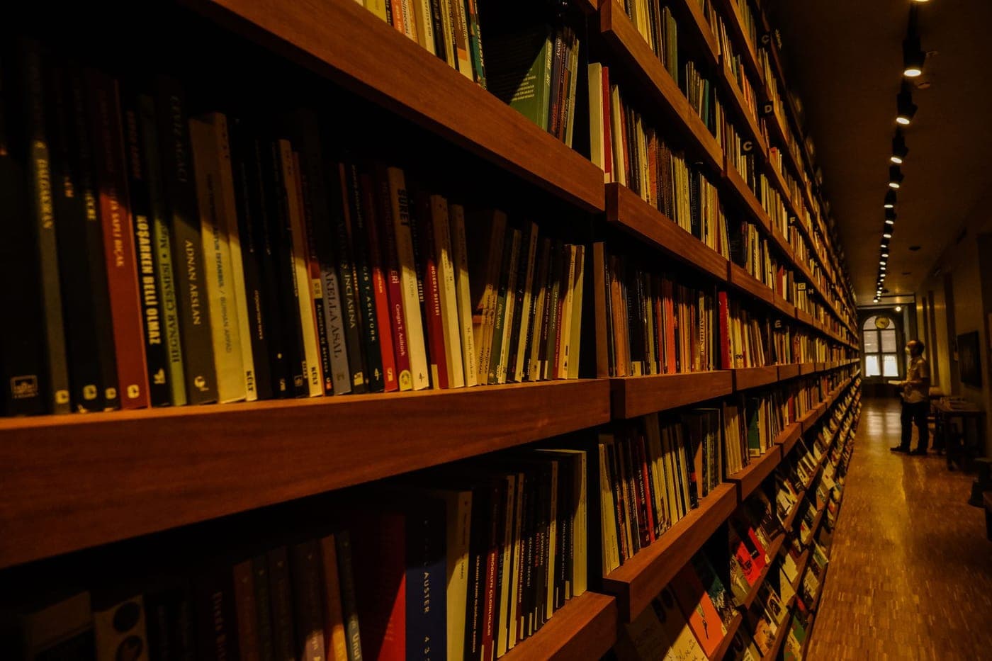 A library reading room lined with tall shelves