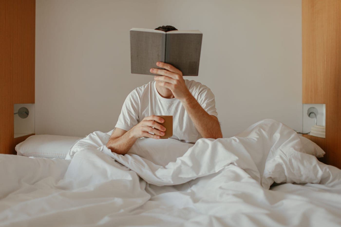 A book being read in bed late at night
